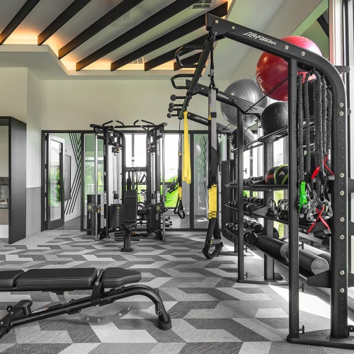 large windows brighten spacious gym