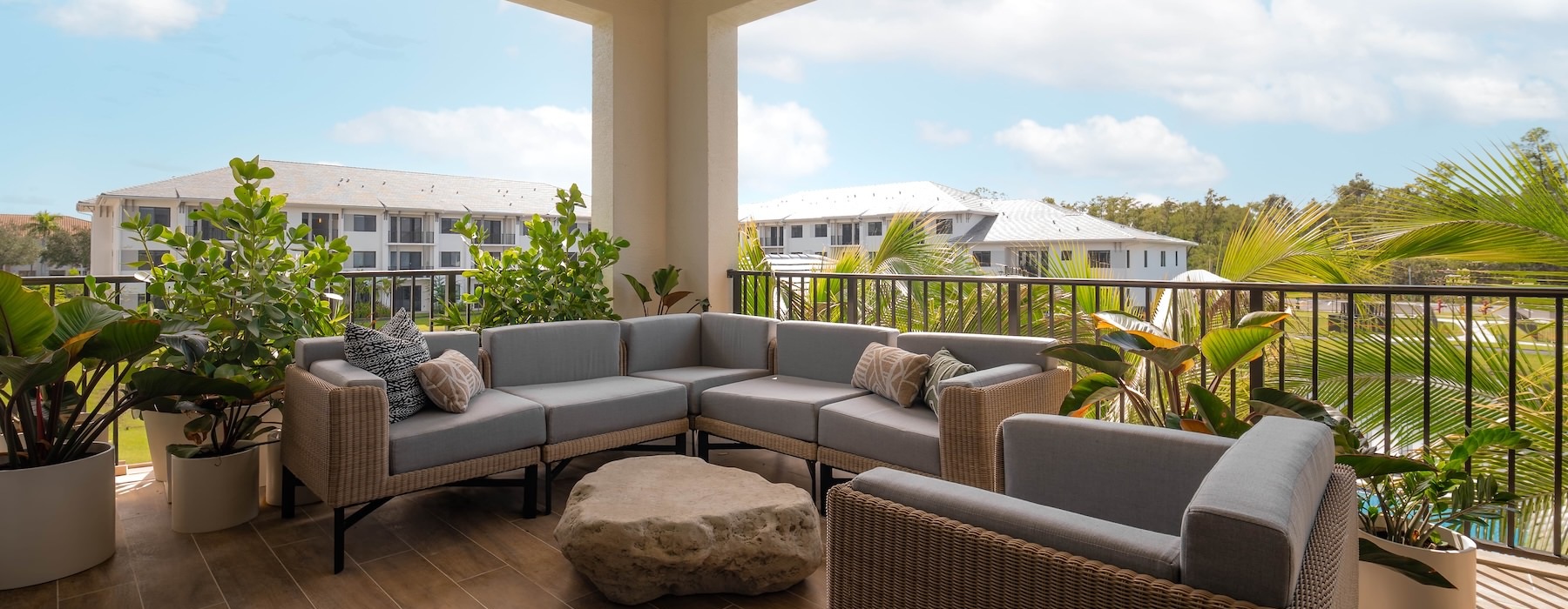 outdoor patio surrounded by green plants