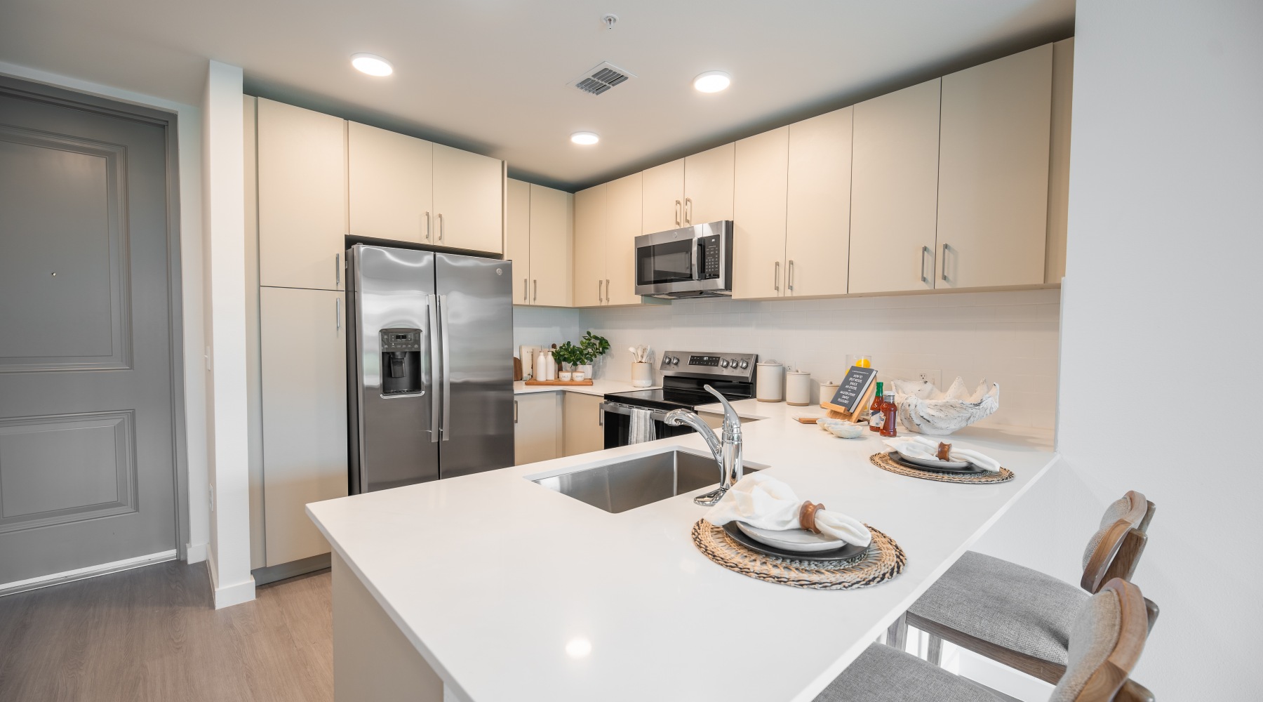 stylish large kitchen with stainless steel appliances