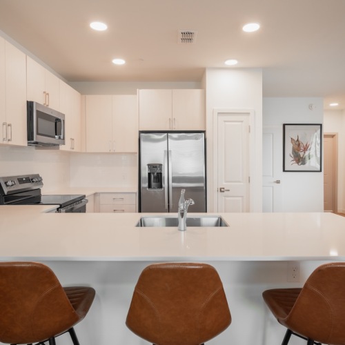 a kitchen with white cabinets