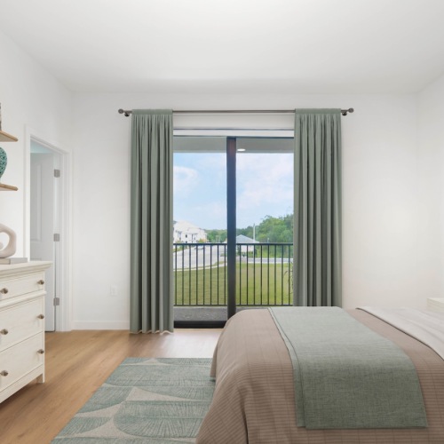 a bedroom with a bed and a dresser