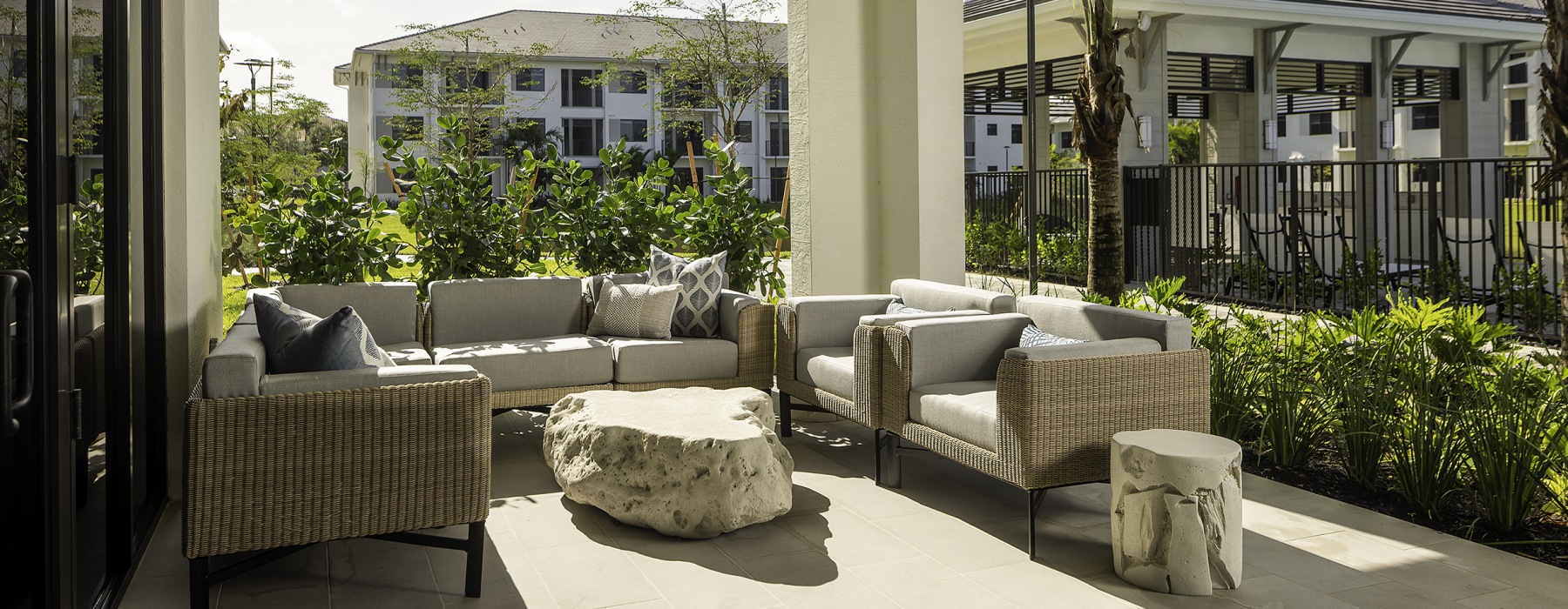 outdoor patio surrounded by green plants