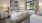 bedroom with ample space around the bed and bright lighting