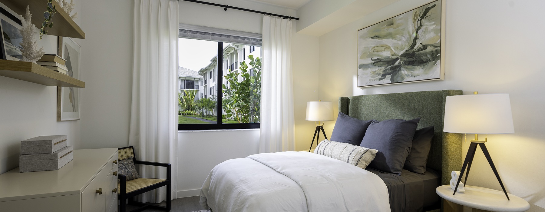 Bedroom with green bed and blue pillows